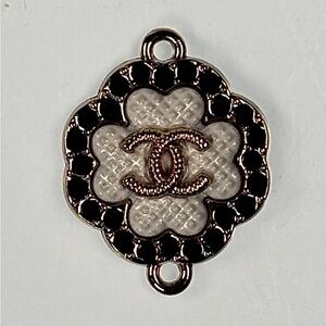 CHANEL Gold and Black crystals charm. Stamped on back